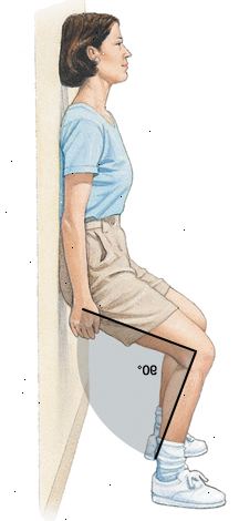 Kvinna som står med ryggen mot väggen, glida ner väggen med knäna böjda i 90 graders vinkel.